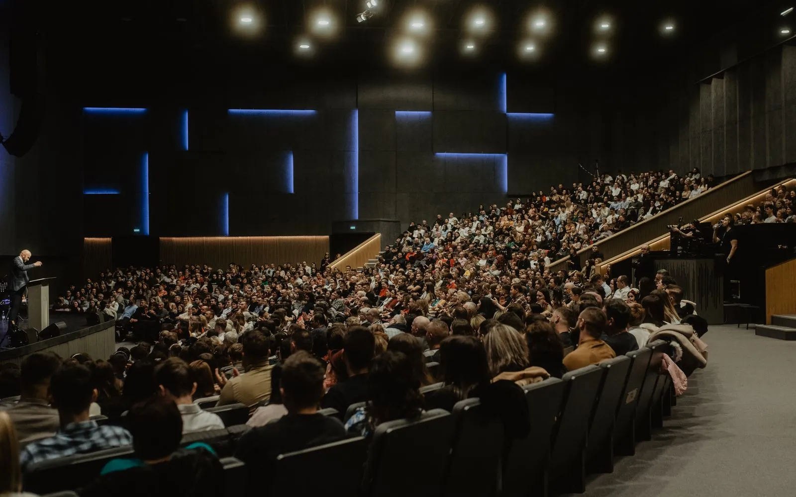 Large auditorium filled with attendees
